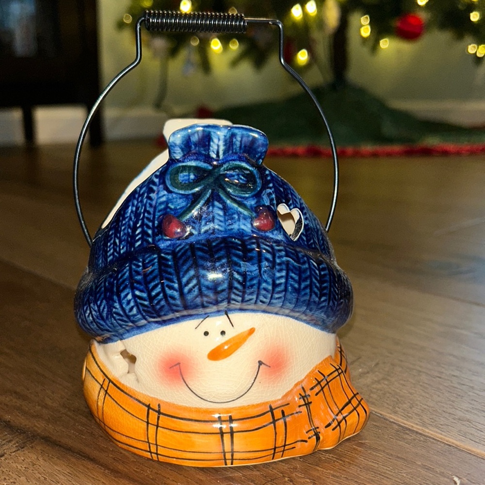 Snowman candle holder.